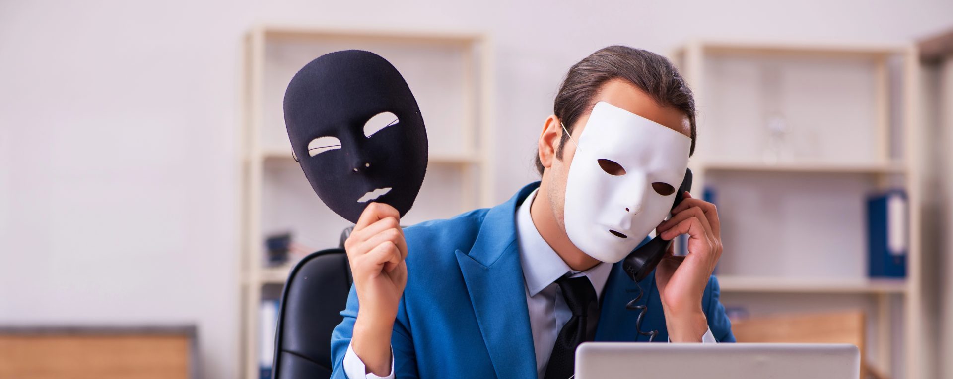 Young male employee wearing masks in the office