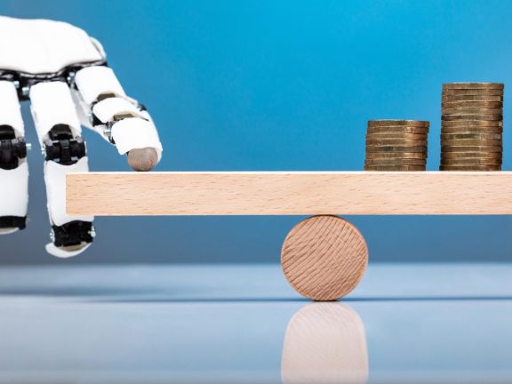 Robot Balancing Stacked Coins With Finger On Wooden Seesaw Against Blue Background