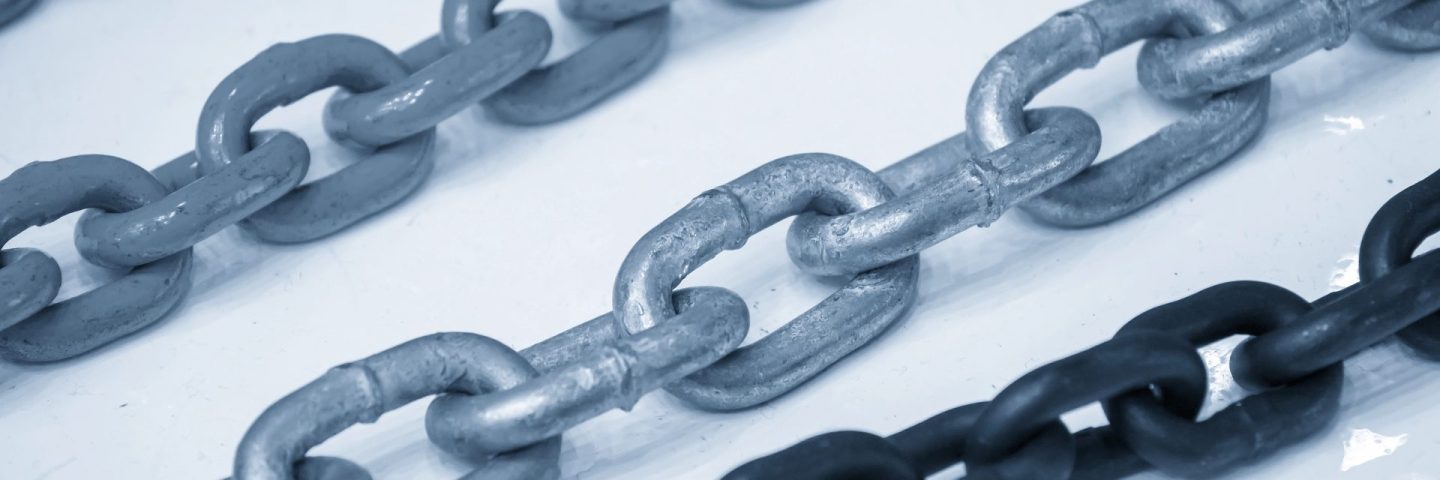 Close up scene the group of chain in the light blue scene. The industrial equipment concept.