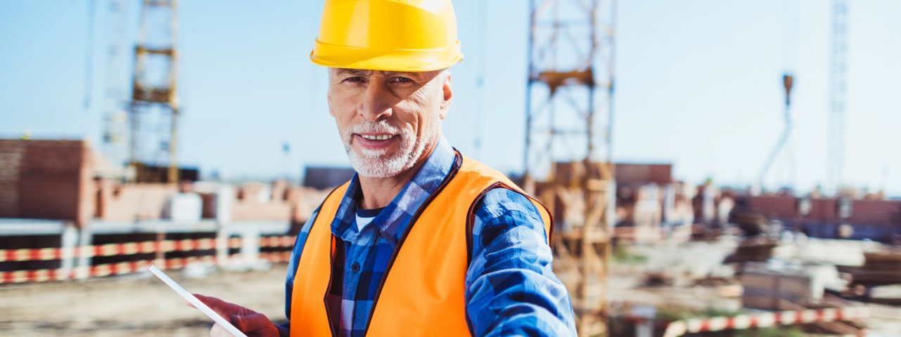 construction worker with building plans