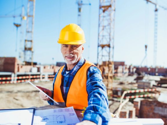 construction worker with building plans