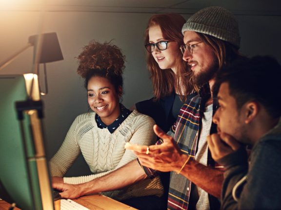 Computer, office collaboration or night team programming ERP software, cybersecurity system or programmer code. App data science, ai developer or diversity teamwork on coding cloud computing database.