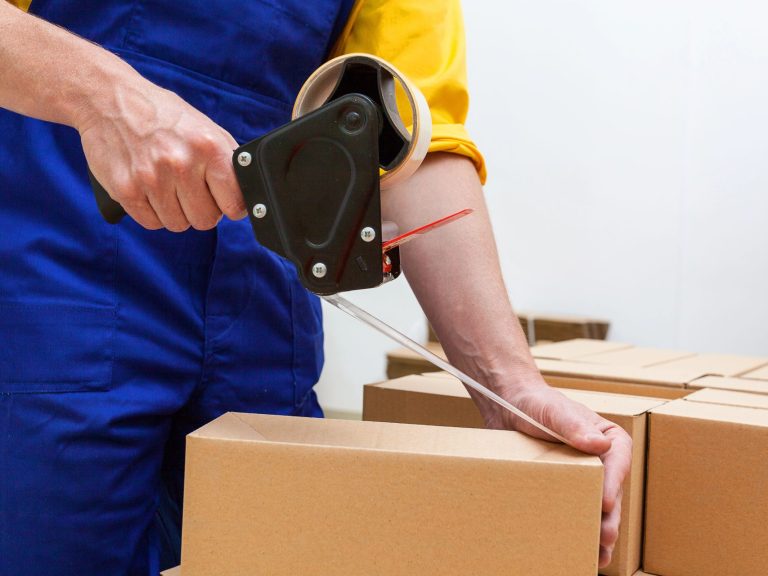 Blue collar worker with tape gun