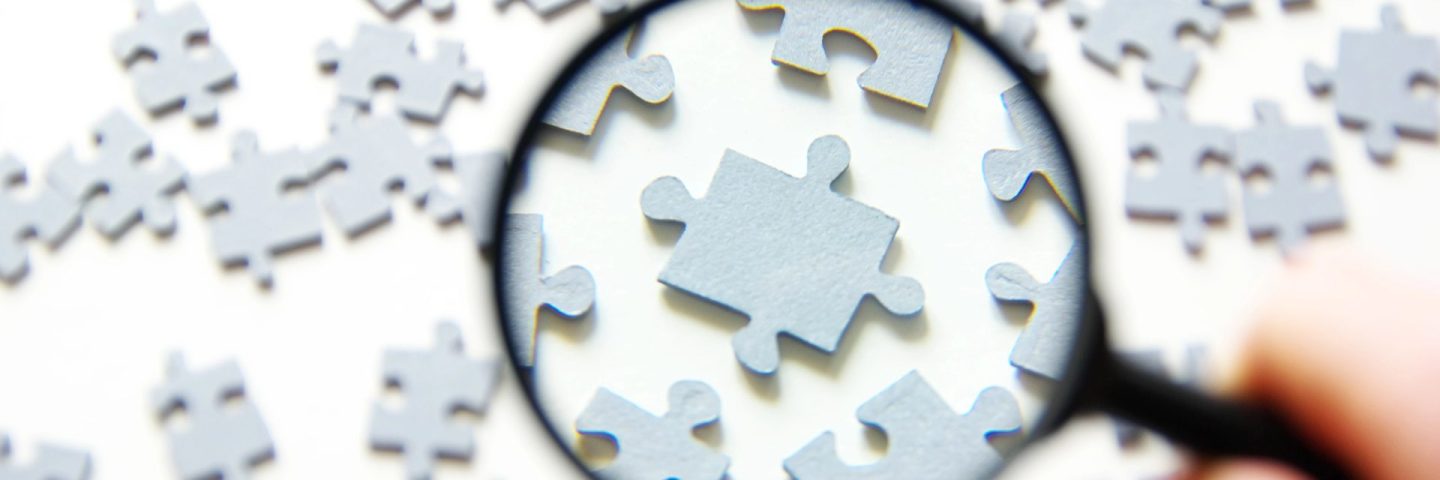 Magnifying glass and puzzle