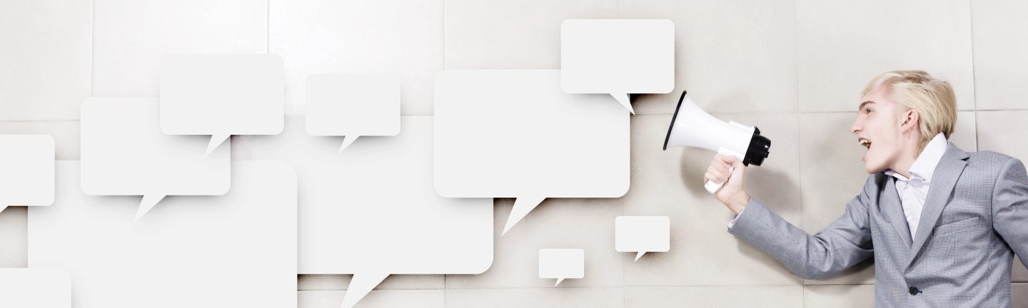 Businessman holding megaphone