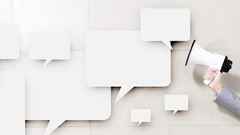 Businessman holding megaphone