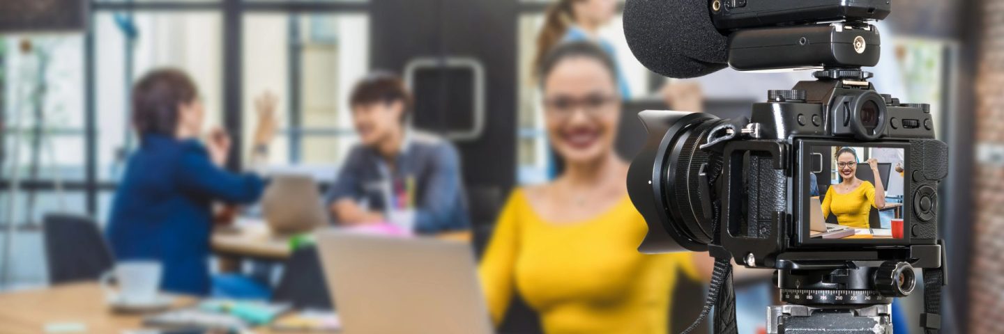 Professional digital Mirror-less camera with microphone recording video blog of Businesswoman working with Group Of Business people. Camera for photographer or Video and Live Streaming concept