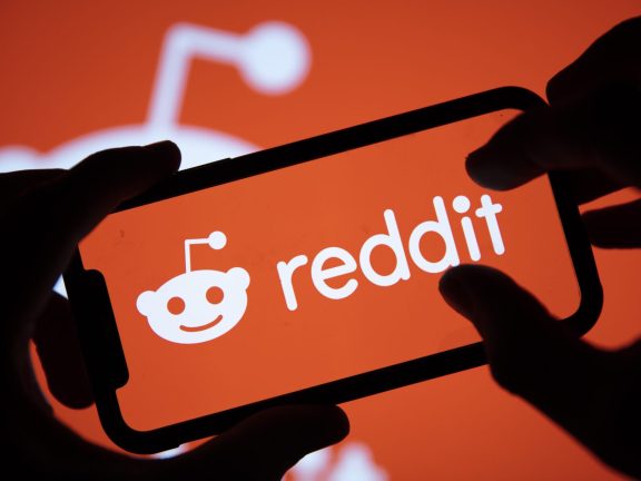 LONDON, UK - February 2021: Reddit logo displayed on a smartphone device